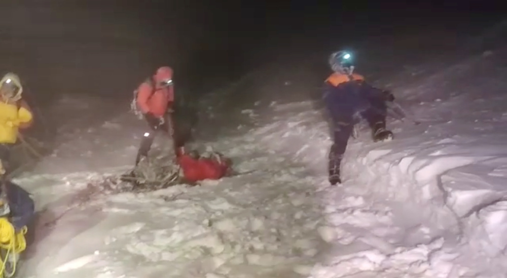 Members of Russiau00e2u20acu2122s Emergencies Ministry conduct a rescue operation after a group of climbers got stuck while climbing Mount Elbrus in this still image from video taken September 23, 2021. u00e2u20acu201d Russiau00e2u20acu2122s Emergencies Ministry pic via Reuters