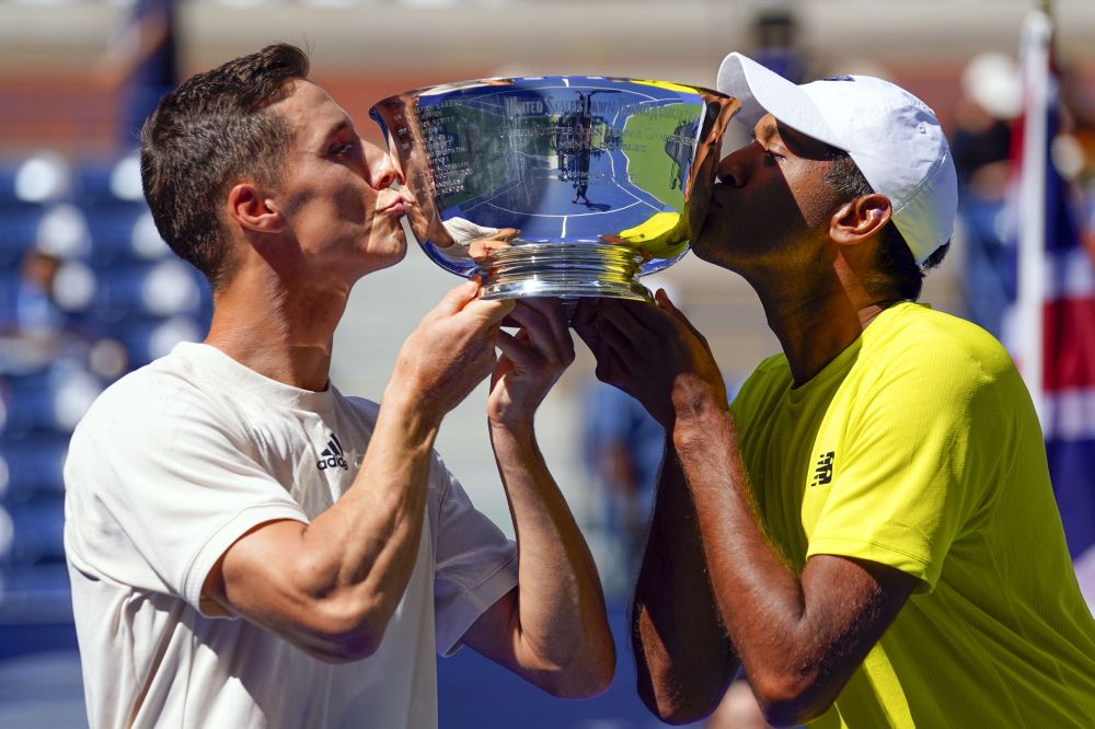 Joe Salisbury of Great Britain, left, and Rajeev Ram of the United States pose with the trophy at the USTA Billie Jean King National Tennis Centre, New York September 10, 2021. u00e2u20acu201d Reuters picn