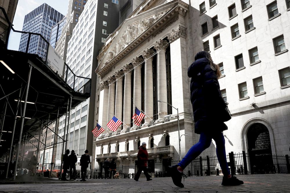 People are seen on Wall Street outside the New York Stock Exchange (NYSE) in New York City, US, March 19, 2021. u00e2u20acu201d Reuters pic