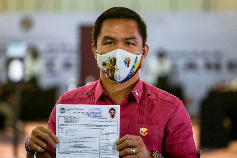 Philippine senator and newly retired boxing icon Manny Pacquiao files his certificate of candidacy to join the presidential race, at Sofitel Harbor Garden Tent, in Pasay City, Metro Manila, Philippines October 1, 2021. u00e2u20acu201d Jam Sta Rosa/Pool via Reuters