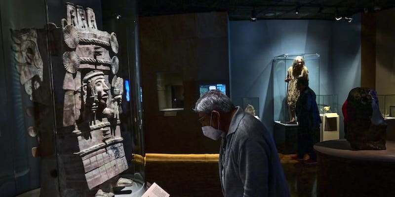 A man looks at the work titled u00e2u20acu02dcChicomecoatlu00e2u20acu2122, of the Mexica culture, during the u00e2u20acu02dcThe Greatness of Mexicou00e2u20acu2122 exhibition. u00e2u20acu201d AFP pic