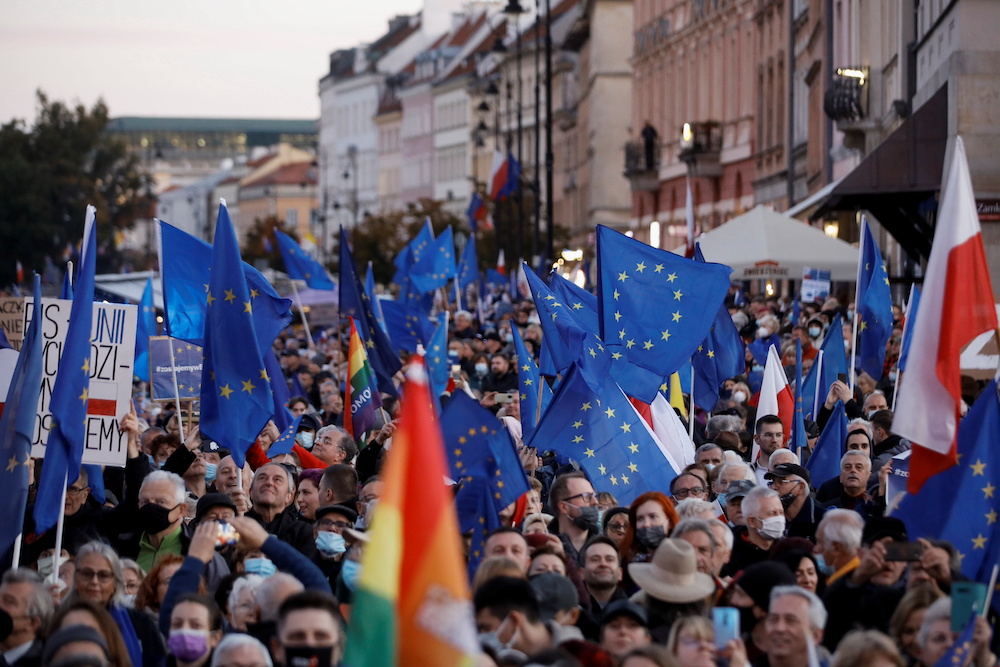 People carry flags, as they take part in a rally in support of Poland's membership in the European Union in Warsaw, Poland October 10, 2021. u00e2u20acu201d Reuters pic