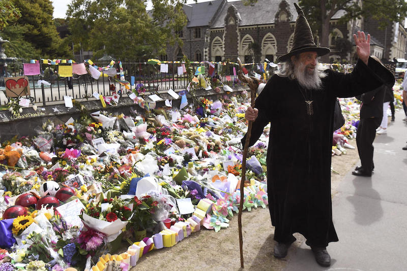 Ian Brackenbury Channell, known as the Wizard, waves in front of a memorial at the Botanic Gardens in Christchurch, New Zealand March 21, 2019. u00e2u20acu201d AFP pic