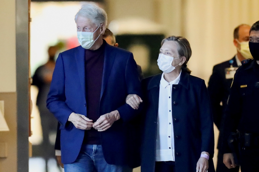 Former US President Bill Clinton, accompanied by his wife, former Secretary of State Hillary Clinton, walks out of University of California Irvine Medical Center, in Orange, California October 18, 2021. u00e2u20acu201d Reuters pic