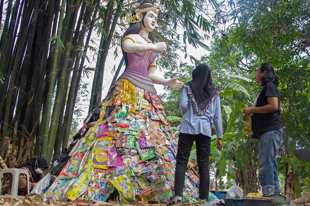 Volunteers of Indonesia’s environmental activist group Ecoton built a mock-up of the Goddess Sri from plastic waste collected from several rivers around the city, at the plastic museum in Gresik regency near Surabaya September 28, 2021. — Reuters pic
