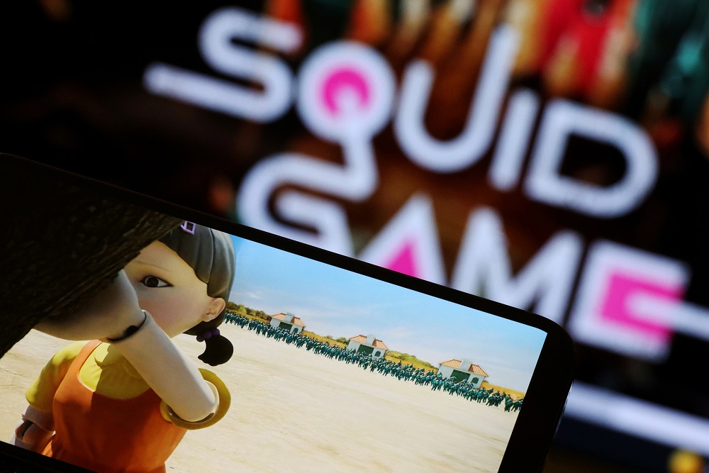 The Netflix series u00e2u20acu02dcSquid Gameu00e2u20acu2122 is played on a mobile phone in this picture illustration taken September 30, 2021. u00e2u20acu201d Reuters pic