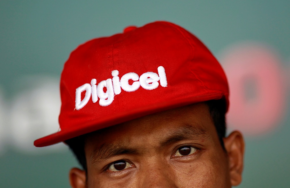 A man wears a cap bearing the brand of Digicel in Yangon April 26, 2013. u00e2u20acu201d Reuters pic