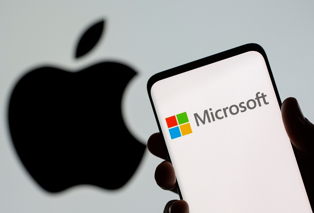  Microsoft logo is seen on the smartphone in front of displayed Apple logo in this illustration taken, July 26, 2021. u00e2u20acu201d Reuters pic