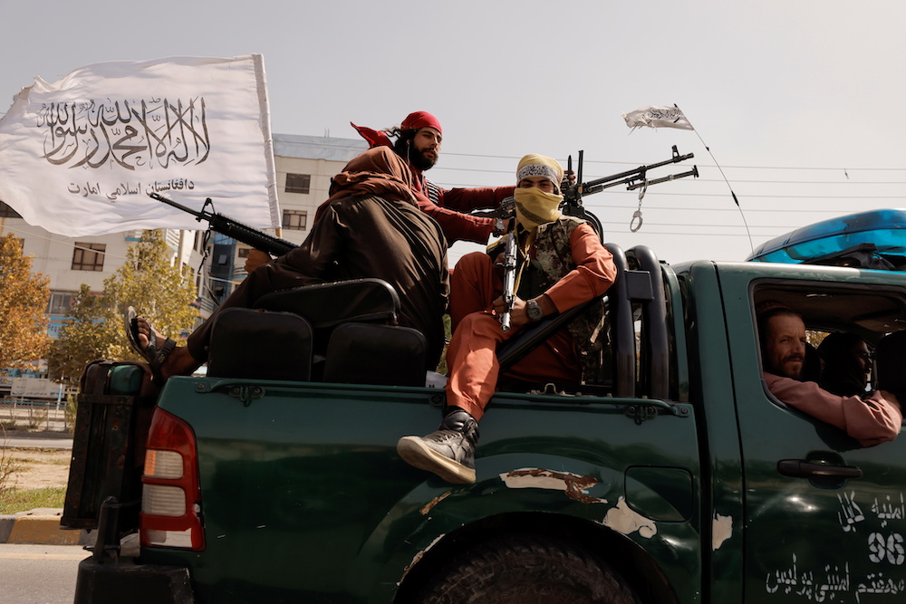Members of Taliban forces ride on a pick-up truck mounted with a weapon in Kabul, Afghanistan, October 3, 2021. u00e2u20acu201d Reuters pic