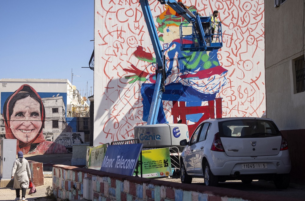 Moroccan street artist Omar Lhamzi works on a mural during the 'Jidar' street art festival in the capital Rabat. u00e2u20acu201d AFP pic 