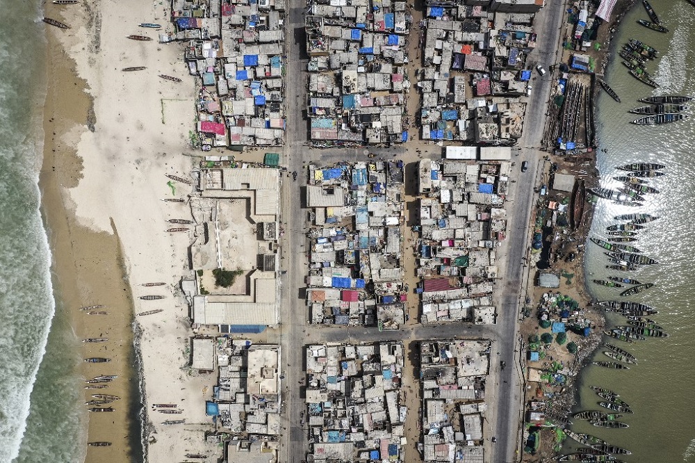 This aerial view shows destroyed houses along the seaside fishing neighbourhood of Guet Nu00e2u20acu2122Dar in Saint Louis on August 12, 2021. u00e2u20acu201d AFP pic