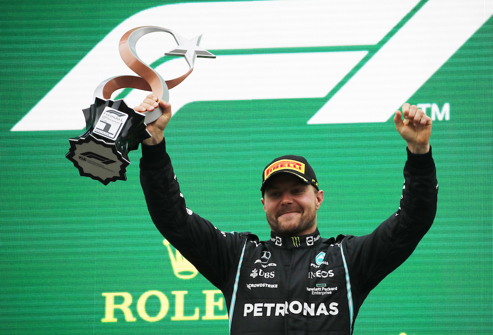 Mercedes' Valtteri Bottas celebrates with the trophy on the podium after winning the race at the Intercity Istanbul Park, Istanbul, Turkey October 10, 2021. u00e2u20acu201d Reuters pic