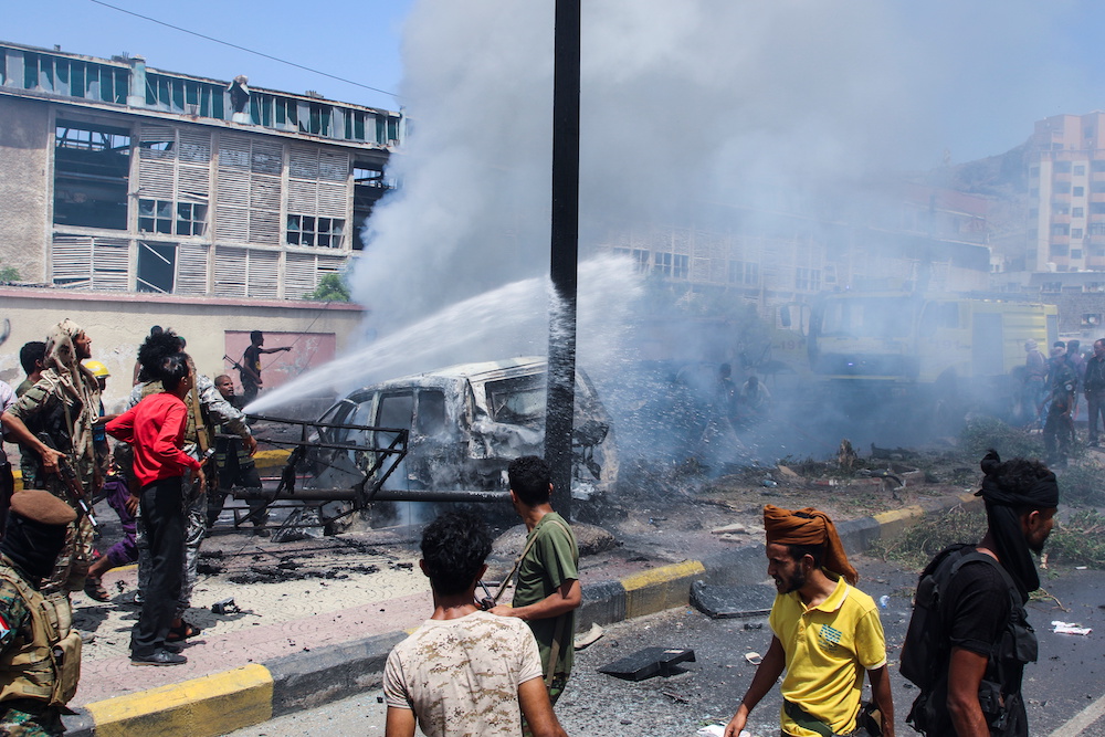 Policemen and firefighters work at the scene of a blast in Aden, Yemen, October 10, 2021. u00e2u20acu201d Reuters pic
