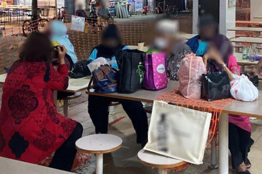 A gathering of more than two people seen at the Haig Road Market and Food Centre. u00e2u20acu201d TODAY pic