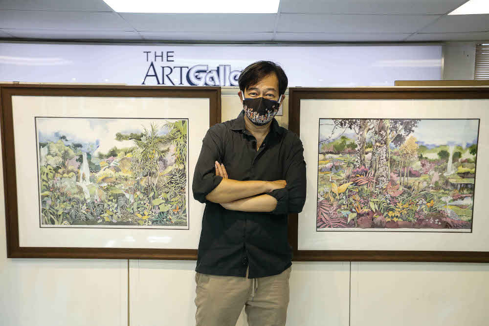 Alex Leong poses for a photo with his paintings during an interview regarding his work being previewed here at The Art Gallery, Pulau Tikus October 15, 2021. u00e2u20acu201d Picture by Sayuti Zainudin