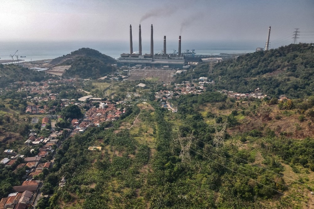 Village houses as smoke rises from the chimneys at the Suralaya coal power plant in Cilegon September 21, 2021. u00e2u20acu201d AFP pic