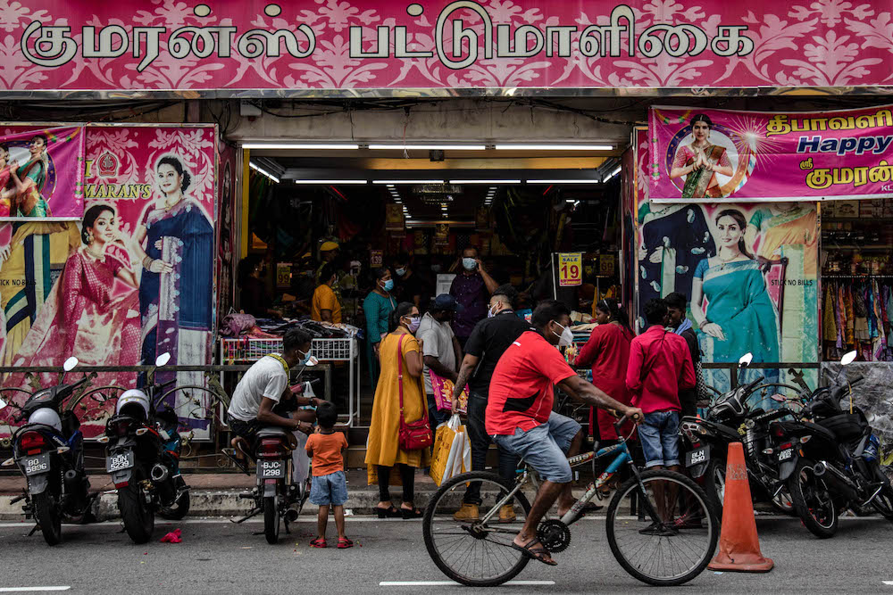 People wearing protective masks shop at Little India, Klang ahead of the upcoming Deepavali festival celebrations on October 23, 2021. u00e2u20acu201d Picture by Firdaus Latif