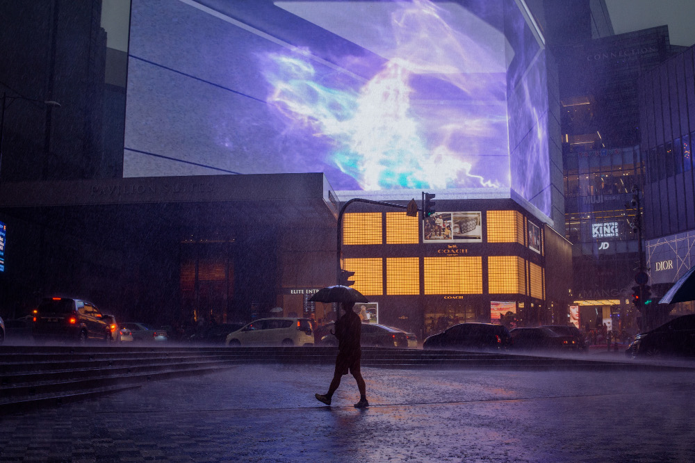 Pedestrians walking on the sidewalk while holding umbrellas in Bukit Bintang, Kuala Lumpur October 23, 2021. u00e2u20acu201d Picture by Shafwan Zaidon