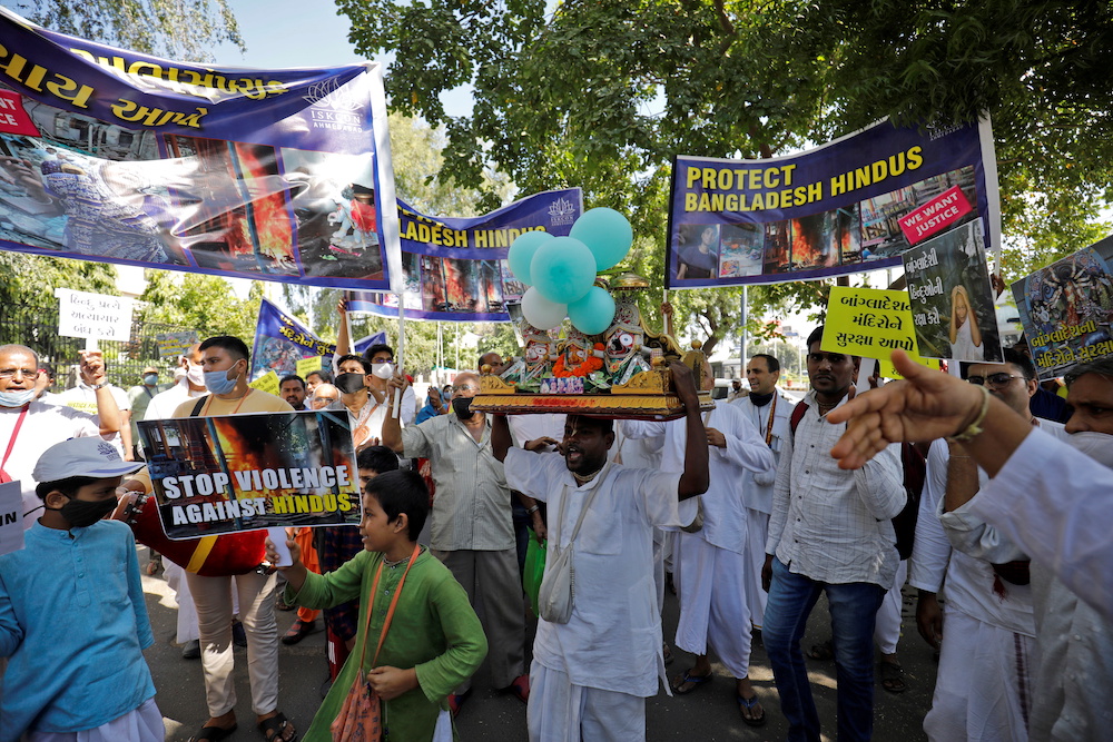 People hold banners and placards during a protest march to condemn attacks against Hindus during Durga Puja festival in Dhaka, in Ahmedabad, India, October 23, 2021. u00e2u20acu201d Reuters pic