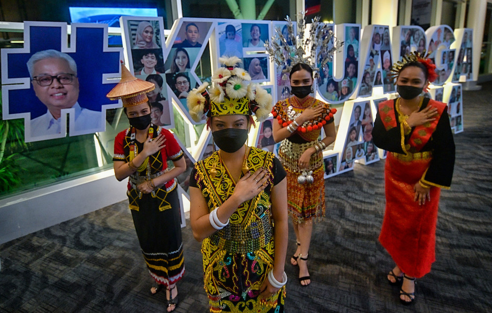 Dancers from the Selangor Art Council in traditional Sarawak tribal garb at the launch of Keluarga Malaysia by Prime Minister Menteri Datuk Seri Ismail Sabri Yaakob at the Borneo Convention Centre Kuching at Kuching, October 23, 2021. u00e2u20acu201d Bernama pic