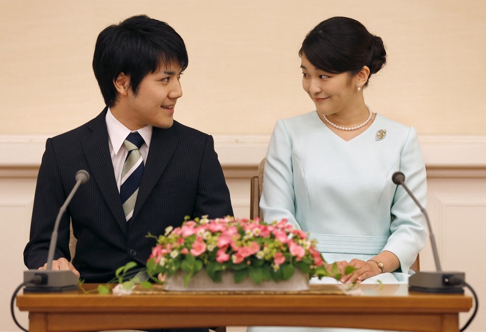 This file photo taken on September 3, 2017 shows Japan's Princess Mako (right) looking at her fiancu00c3u00a9 Kei Komuro (left), as they meet the media during a press conference to announce their engagement at the Akasaka East Residence in Tokyo. u00e2u20acu201d AFP pic