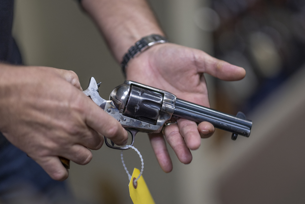 Props expert Guillaume Delouche at Independent Studio Services holds a prop gun while talking about them in Sunland-Tujunga, Los Angeles, California on October 22, 2021. u00e2u20acu201d AFP pic