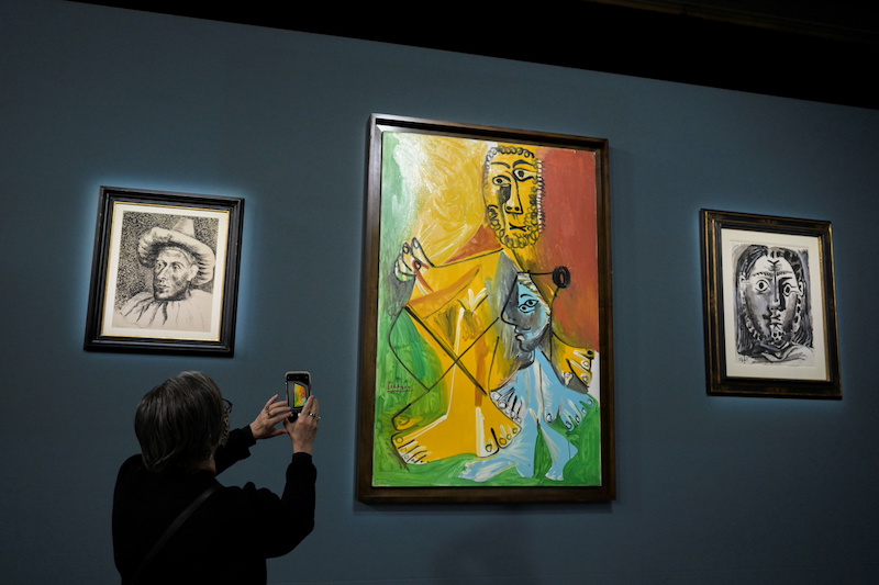 An attendee photographs a painting prior to the auction of 11 Picasso paintings and works at the Bellagio Hotel in Las Vegas, Nevada October 23, 2021. u00e2u20acu201d Reuters pic
