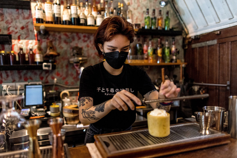 This picture taken on October 9, 2021 shows a member of the bar staff preparing a kratom-infused mocktail at the Teens of Thailand cocktail bar in Bangkok. u00e2u20acu201d AFP pic