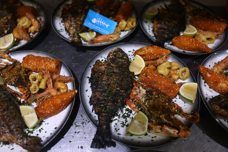 Plates of various seafood are pictured before being served to customers at Roma fish restaurant owned by the Abu Hassira family in Gaza City, on October 23, 2021. u00e2u20acu201d AFP pic