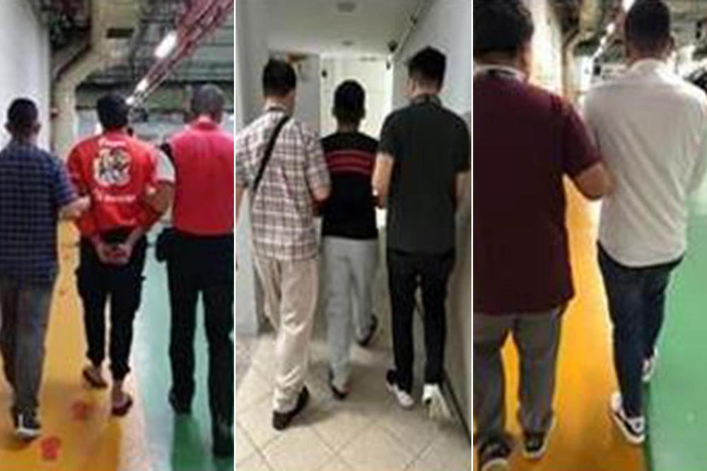 Suspected members of a job scam syndicated being arrested in a joint operation between Singapore and Malaysia police. u00e2u20acu201d Picture courtesy of Singapore Police Force