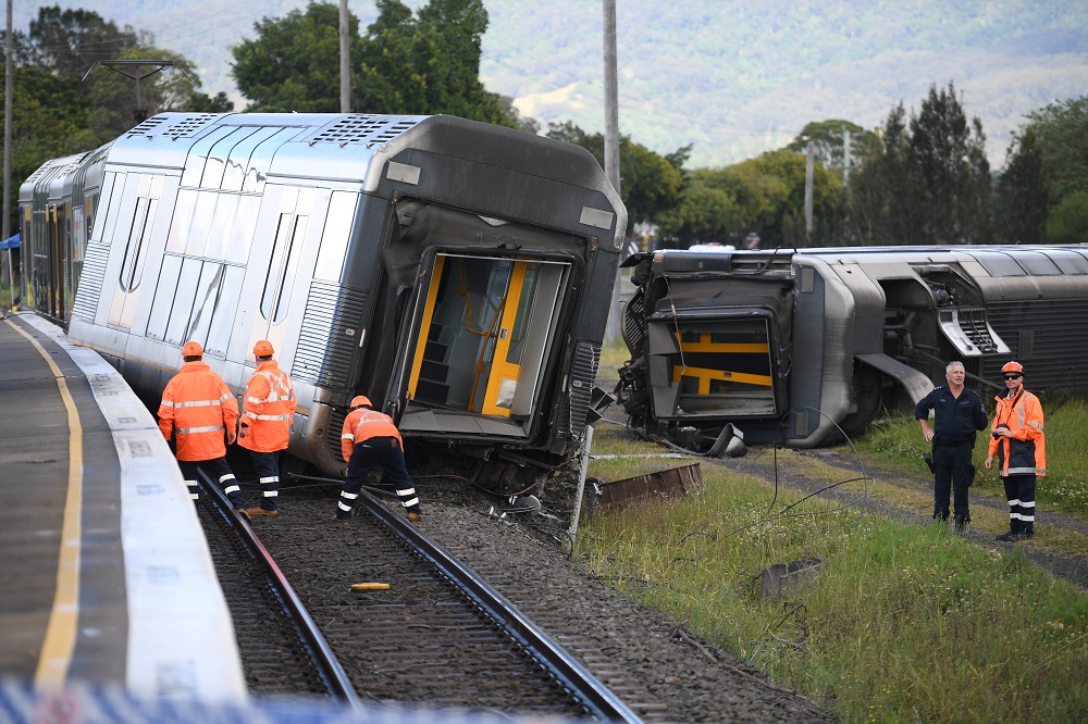 A derailed passenger train is seen after it hit a car on a level crossing in Kembla Grange, Australia, October 20, 2021. u00e2u20acu2022 AAP Image/Dean Lewins via Reuters