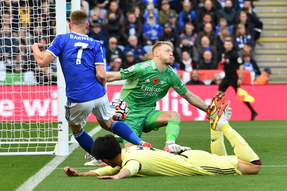 Arsenalu00e2u20acu2122s English goalkeeper Aaron Ramsdaleduring the English Pr (right) saves a shot from Leicester Cityu00e2u20acu2122s English midfielder Harvey Barnes at the Premier League football match between Leicester City and Arsenal at King Power Stadium in Leicester, ce