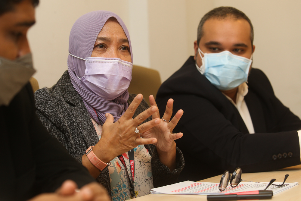 Brilliance Information Sdn Bhd director Asmar Haiza Ishak with lawyers Daljit Singh (right) and Nicholas Mark Pereira giving a press conference to address the issues raised in the Auditor Generalu00e2u20acu2122s Report, October 4, 2021. u00e2u20acu201d Picture by Choo Choy May