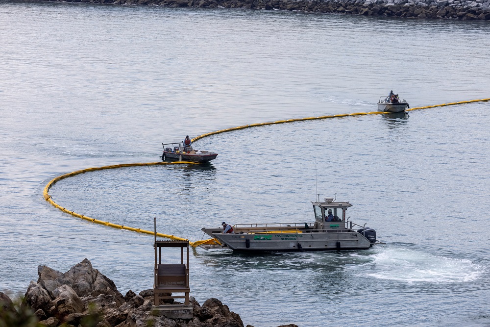 Workers seal off the entrance to Newport Beach harbour as a major oil spill off the coast of California travels south in ocean currents, towards Newport Beach, California October 4, 2021. u00e2u20acu2022 Reuters pic