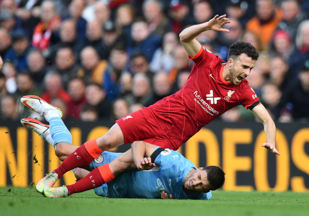 Manchester Cityu00e2u20acu2122s Ruben Dias fouls Liverpoolu00e2u20acu2122s Diogo Jota before being shown a yellow card at Anfield, Liverpool, October 3, 2021. u00e2u20acu201d Reuters pic 