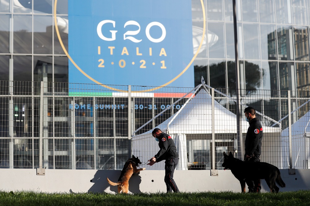 Carabinieri police officers inspect the area with explosive detection dogs outside the convention centre ‘La Nuvola’ (the cloud) ahead of the G20 summit in Rome, Italy October 27, 2021. ― Reuters pic