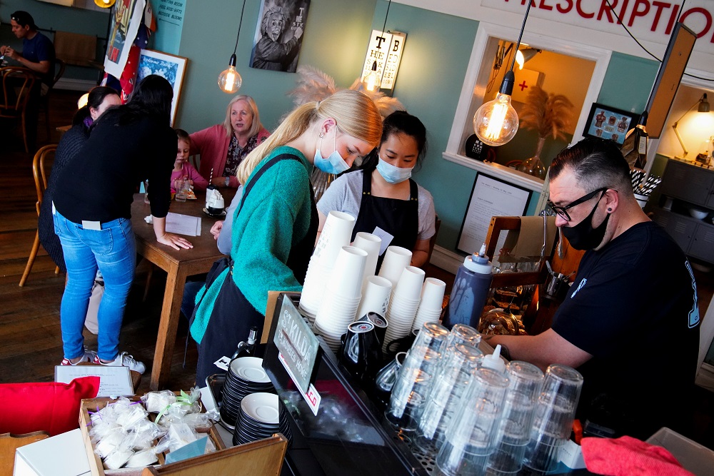 Adam Taylor and his staff prepare coffees at The St Kilda Dispensary cafe on the second day of eased Covid-19 regulations, following a lockdown to curb an outbreak, in Melbourne, Australia October 23, 2021. u00e2u20acu2022 Reuters pic