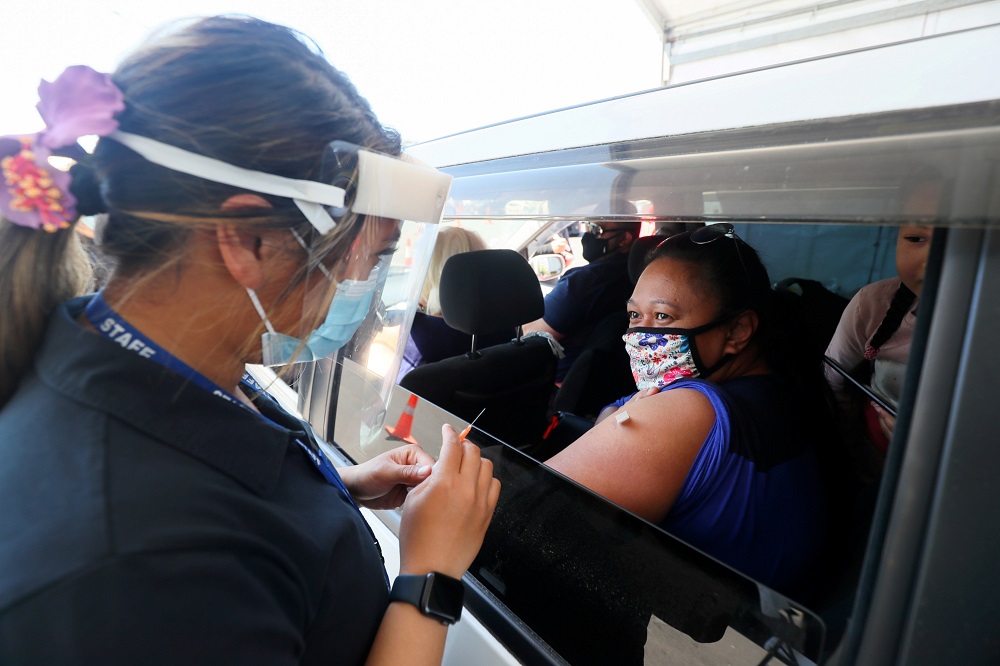 A member of the public receives the Pfizer vaccine at a drive-through vaccination clinic in Otara, Auckland, New Zealand October 16, 2021. u00e2u20acu2022 Reuters file pic