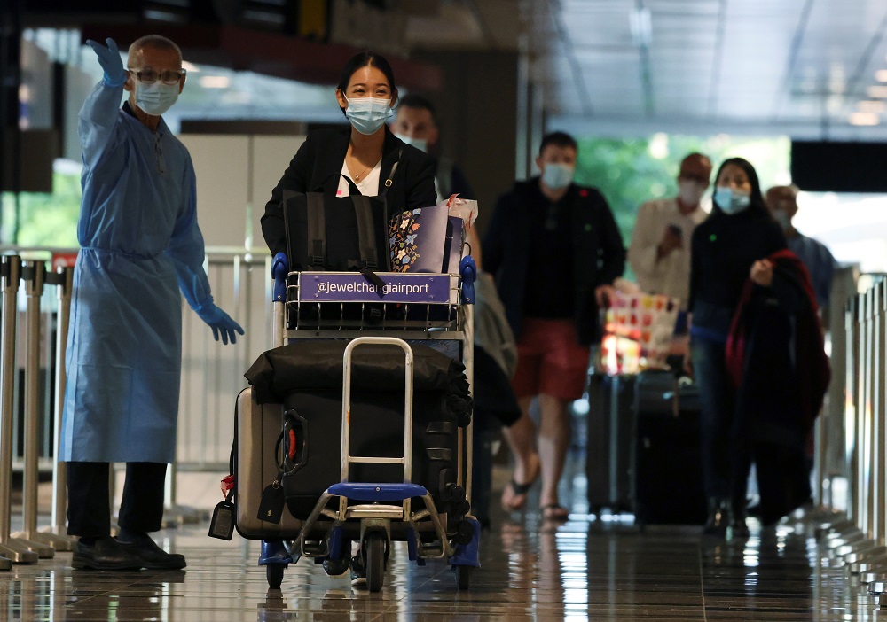 Passengers from Amsterdam arrive at Changi Airport under Singaporeu00e2u20acu2122s expanded Vaccinated Travel Lane (VTL) quarantine-free travel scheme, October 20, 2021. u00e2u20acu2022 Reuters pic