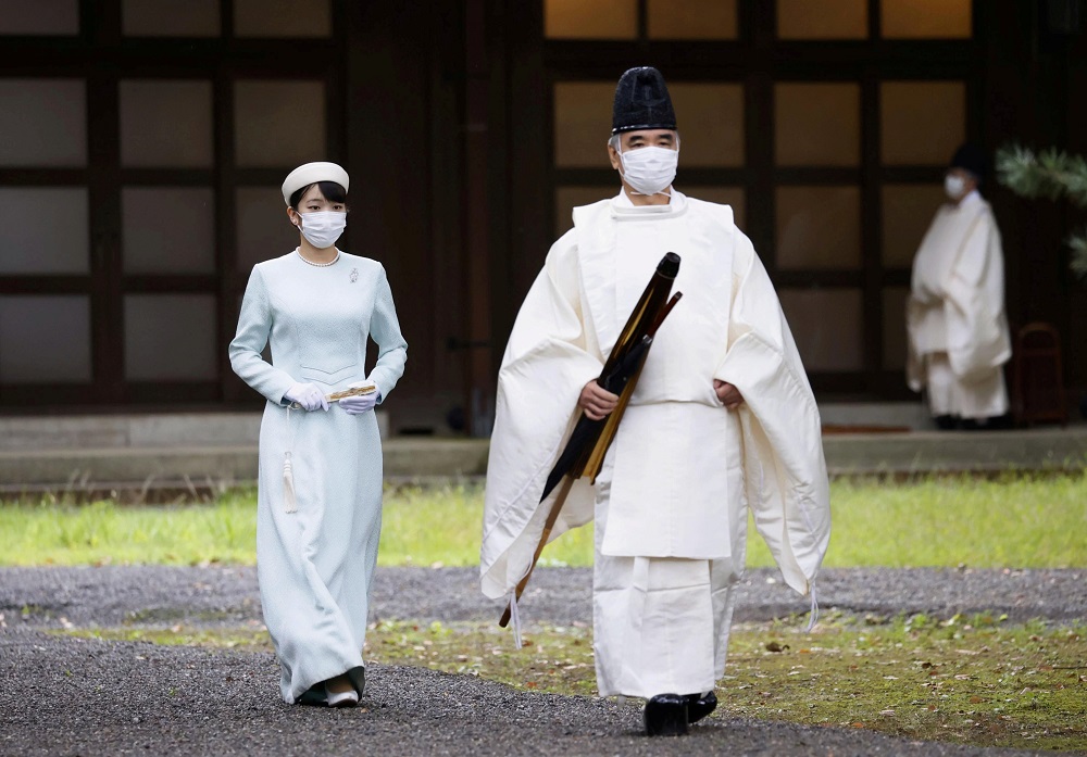 Japan's Princess Mako, the daughter of Crown Prince Akishino and Crown Princess Kiko, walks towards the Three Palace Sanctuaries to pray ahead of her marriage at the Imperial Palace in Tokyo, Japan October 19, 2021, in this photo taken by Kyodo. u00e2u20acu2022 Kyodo