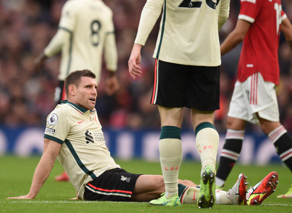 Liverpool midfielder James Milner goes down injured during the English Premier League match against Manchester United at Old Trafford in Manchester, October 24, 2021. u00e2u20acu201d AFP pic 