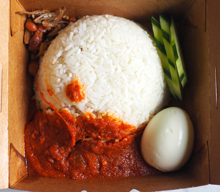 The 'nasi lemak' is packed in a brown paper box and is great for breakfast or lunch.