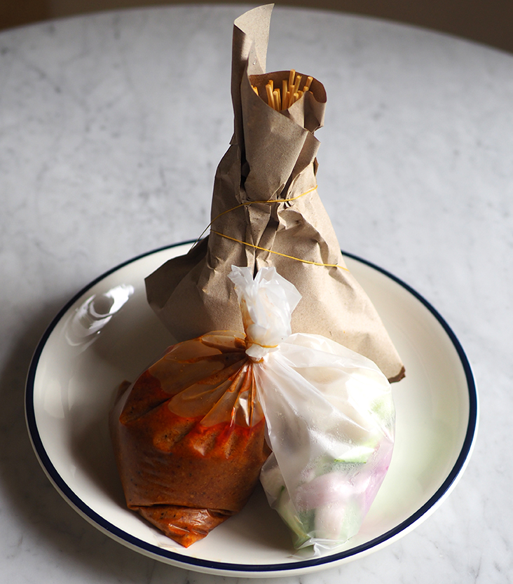 The satay is wrapped in brown paper that retains the juices which you can also use as a sauce.