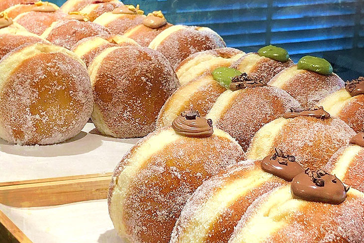 Filled doughnuts come in pleasing flavours such as matcha, dark chocolate, passion fruit with chocolate and raspberry.