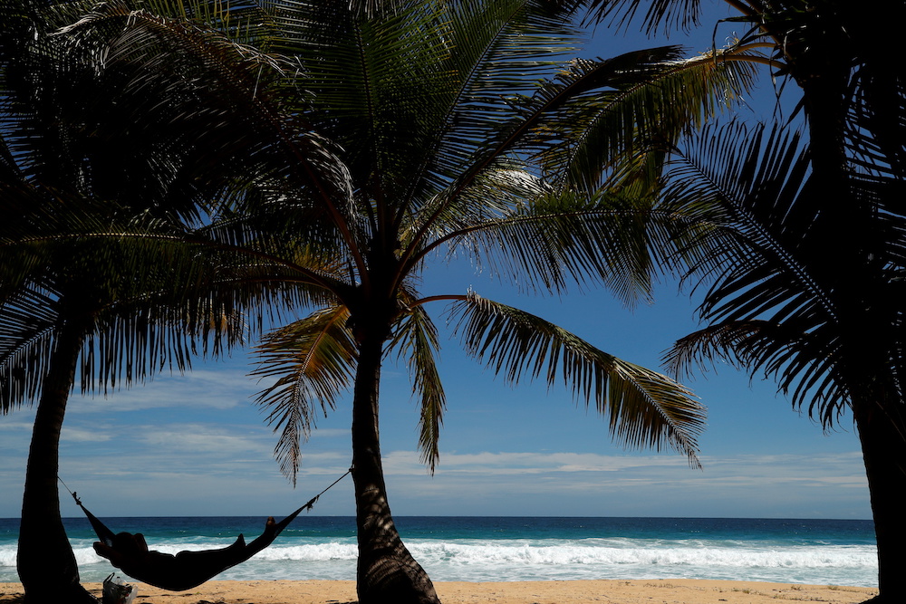 A man relaxes on Karon beach as Phuket gets ready to open to overseas tourists from July 1 allowing fully vaccinated foreigns to visit the resort island without quarantine, Phuket, Thailand June 29, 2021. u00e2u20acu2022 Reuters picnn