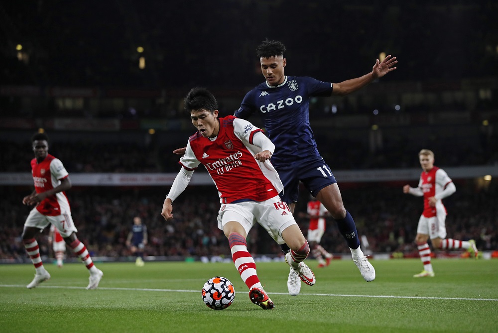 Arsenal's Takehiro Tomiyasu in action with Aston Villa's Ollie Watkins, October 23, 2021. u00e2u20acu2022 Reuters pic