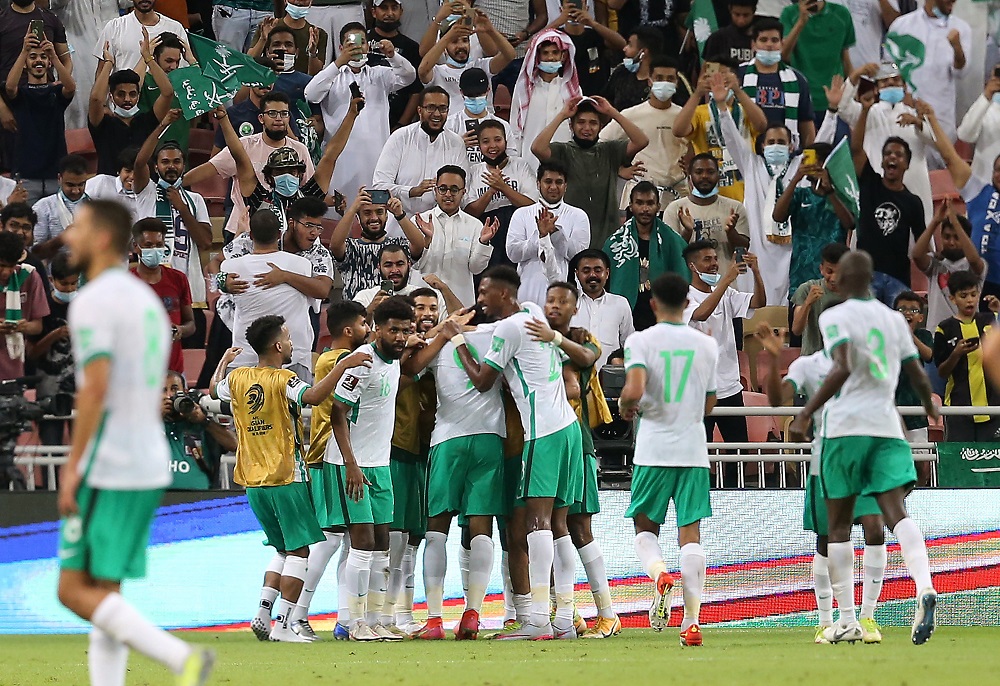 Saudi Arabiau00e2u20acu2122s Feras Al Brikan celebrates with teammates after scoring the first goal against Japan October 8, 2021. u00e2u20acu2022 Reuters pic