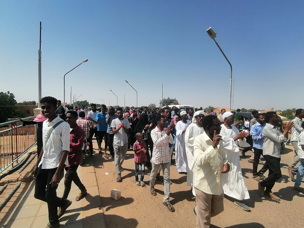 Sudanese demonstrators march and chant during a protest against the military takeover, in Atbara, Sudan October 27, 2021 in this social media image. u00e2u20acu2022 Ebaid Ahmed via Reuters