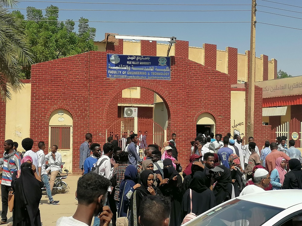 Sudanese demonstrators march and chant during a protest against the military takeover, in Atbara, Sudan October 27, 2021 in this social media image. u00e2u20acu2022 Ebaid Ahmed via Reuters 