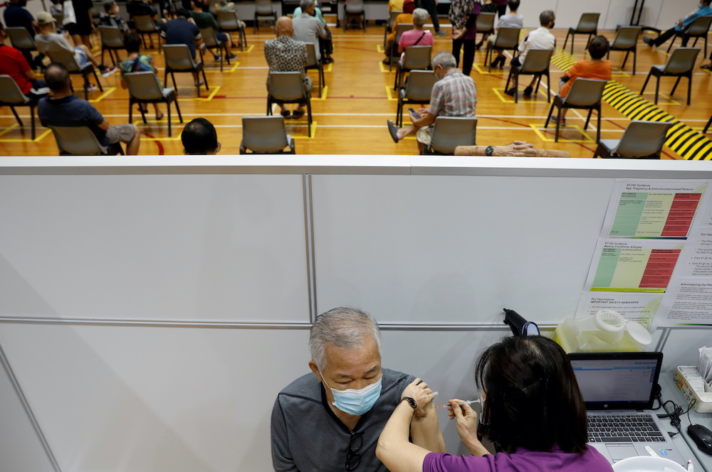 A man receives his vaccination at a coronavirus disease vaccination centtr in Singapore March 8, 2021. u00e2u20acu201d AFP picnn
